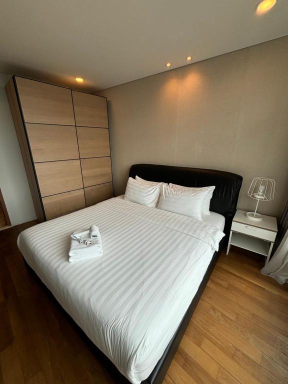 Postel nebo postele na pokoji v ubytování Stella Maison KLCC