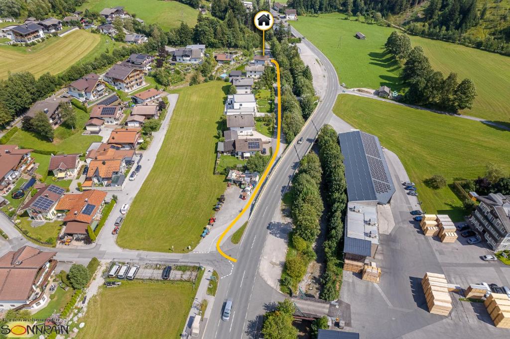 an aerial view of a village with houses and a road at Sonnrain GmbH Apartment Sonnberg 77 Leogang in Leogang