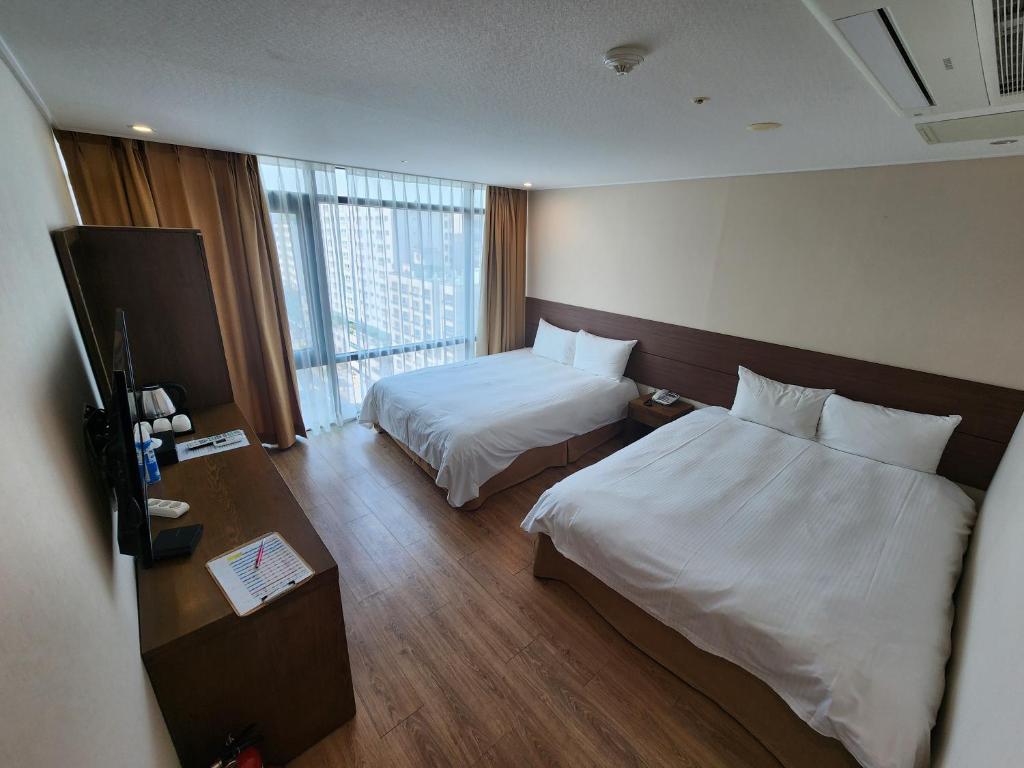 Postel nebo postele na pokoji v ubytování Hotel Haema