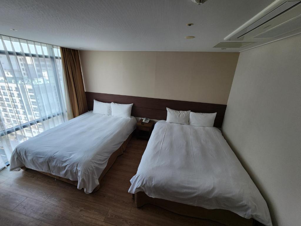 Postel nebo postele na pokoji v ubytování Hotel Haema