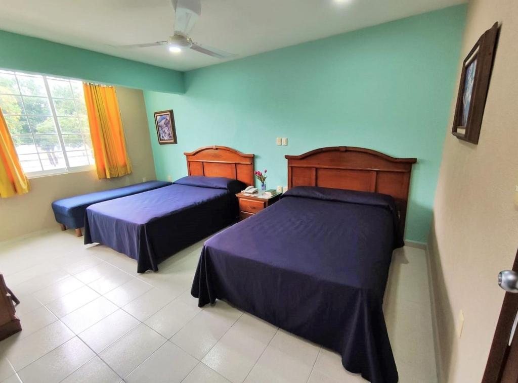 Postel nebo postele na pokoji v ubytování Novotel De Poza Rica