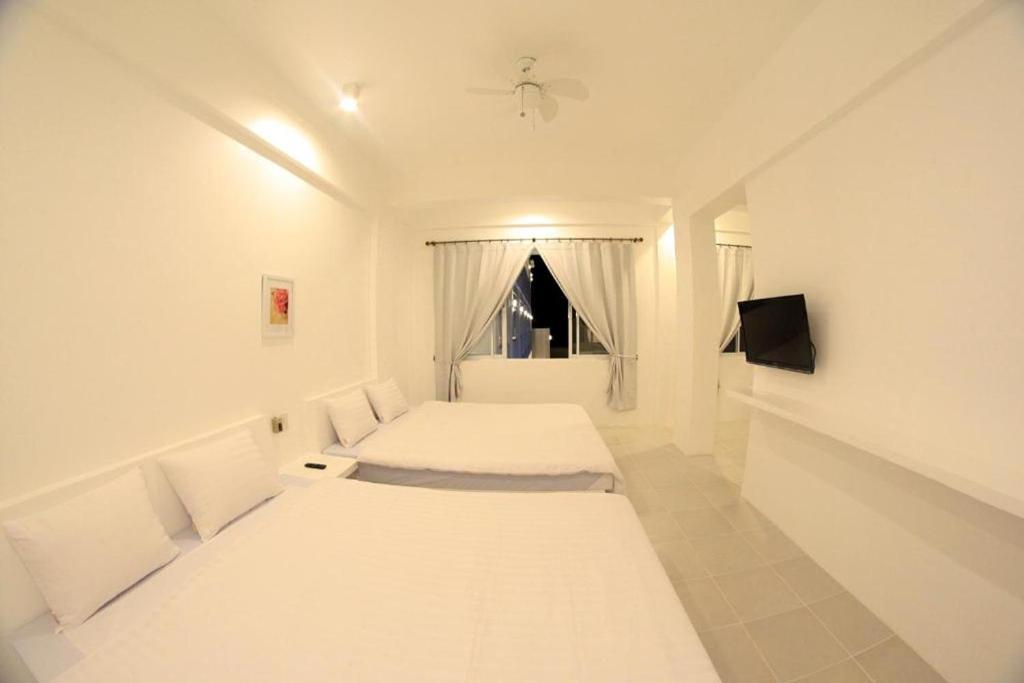Postel nebo postele na pokoji v ubytování Coron Bluewave Hotel