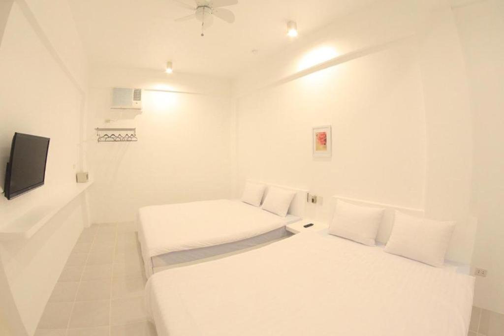 Postel nebo postele na pokoji v ubytování Coron Bluewave Hotel