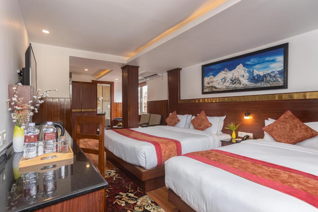 Postel nebo postele na pokoji v ubytování Thamel Boutique Hotel