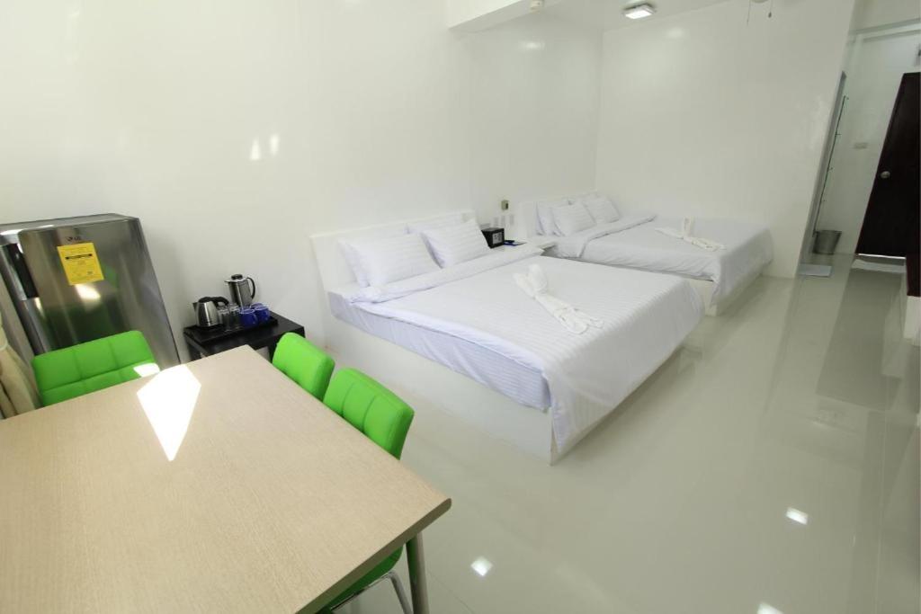 Postel nebo postele na pokoji v ubytování Coron Bluewave Hotel