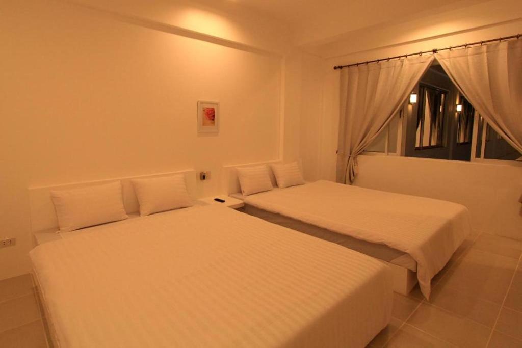 Postel nebo postele na pokoji v ubytování Coron Bluewave Hotel