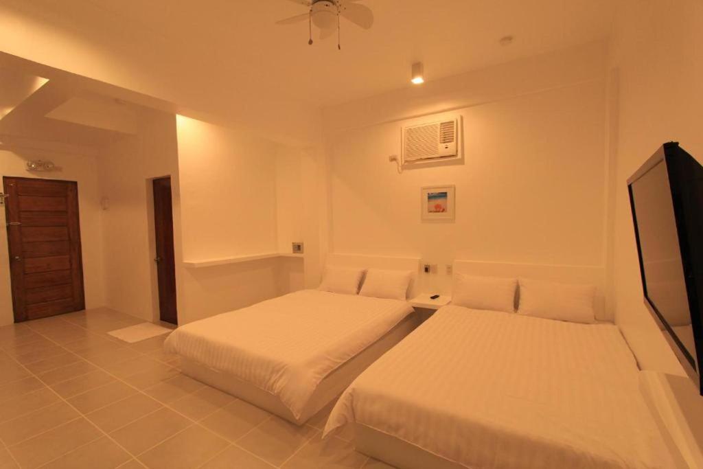 Postel nebo postele na pokoji v ubytování Coron Bluewave Hotel