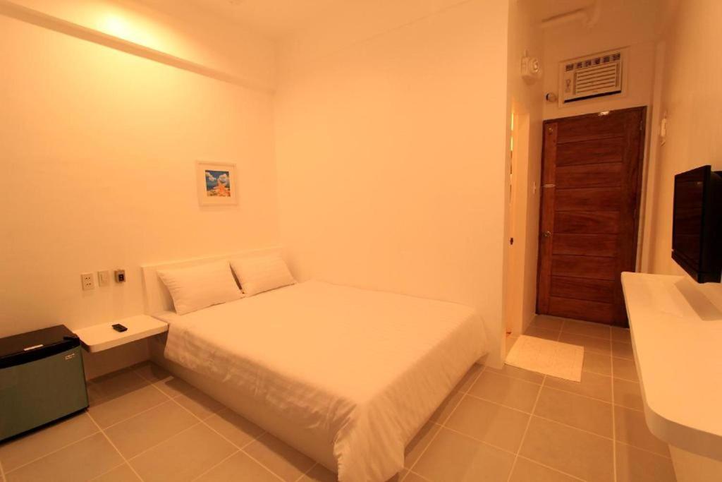 Postel nebo postele na pokoji v ubytování Coron Bluewave Hotel