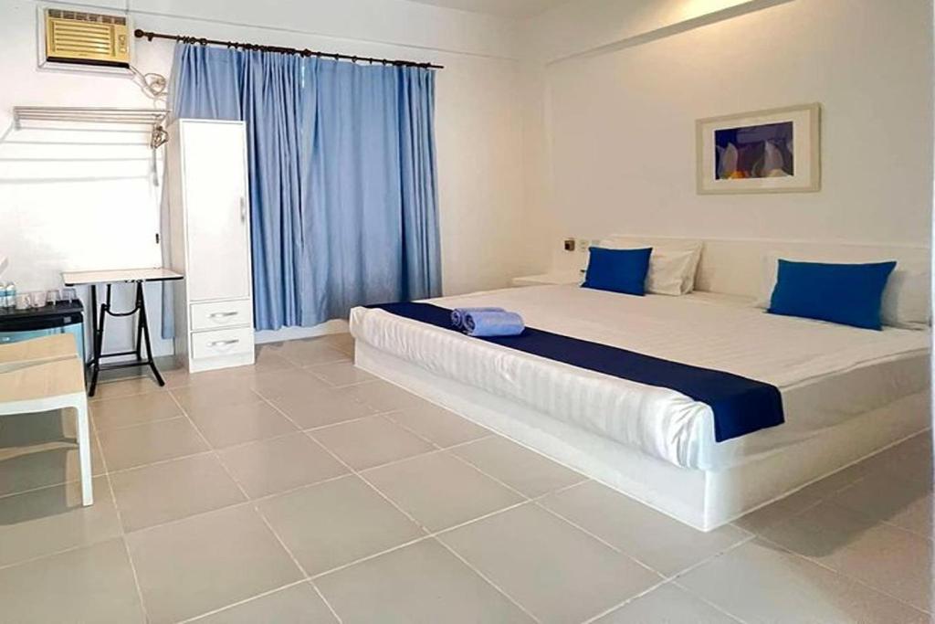 Postel nebo postele na pokoji v ubytování Coron Bluewave Hotel