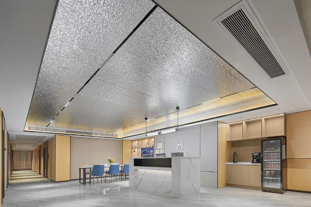 Kuchyň nebo kuchyňský kout v ubytování Meiye Hotel Zhujiang Newtown - Wuyangcun Metro - Canton Fair