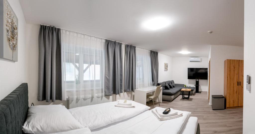 Postel nebo postele na pokoji v ubytování Apartmány LAGUNA