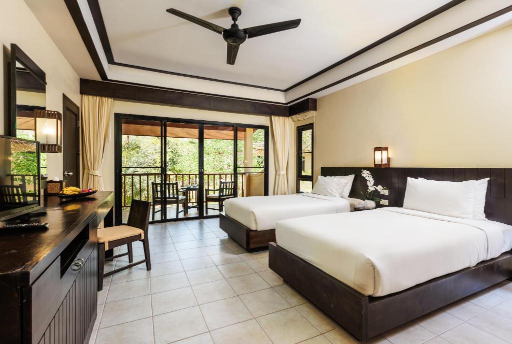 Postel nebo postele na pokoji v ubytování Nang Thong Beach Resort