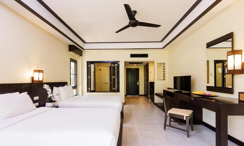 Postel nebo postele na pokoji v ubytování Nang Thong Beach Resort