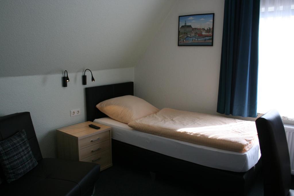 Postel nebo postele na pokoji v ubytování Hotel Haus Wittwer