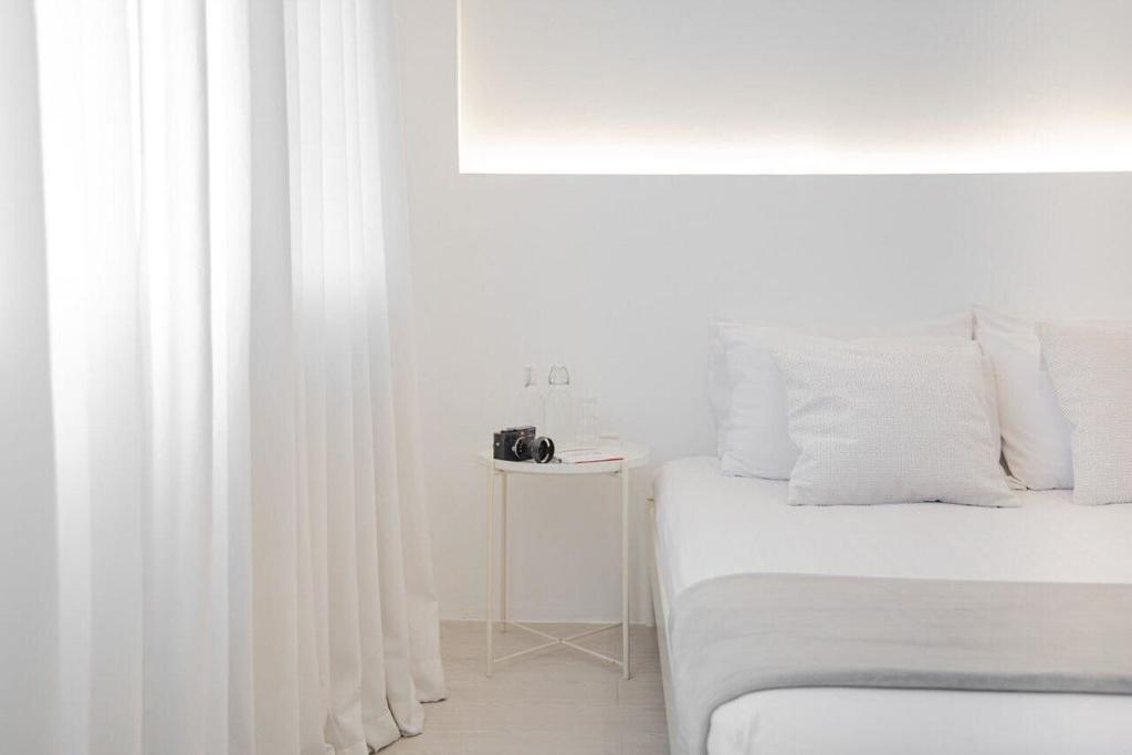 Postel nebo postele na pokoji v ubytování HAO Hotel Phuket