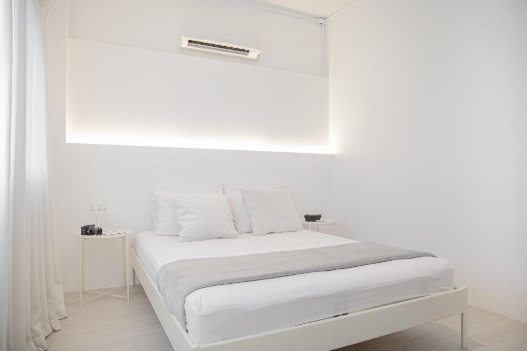 Postel nebo postele na pokoji v ubytování HAO Hotel Phuket