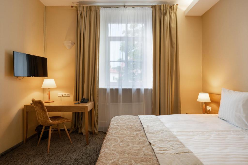 Postel nebo postele na pokoji v ubytování Mabre Residence