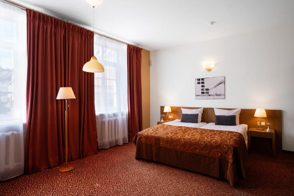 Postel nebo postele na pokoji v ubytování Mabre Residence