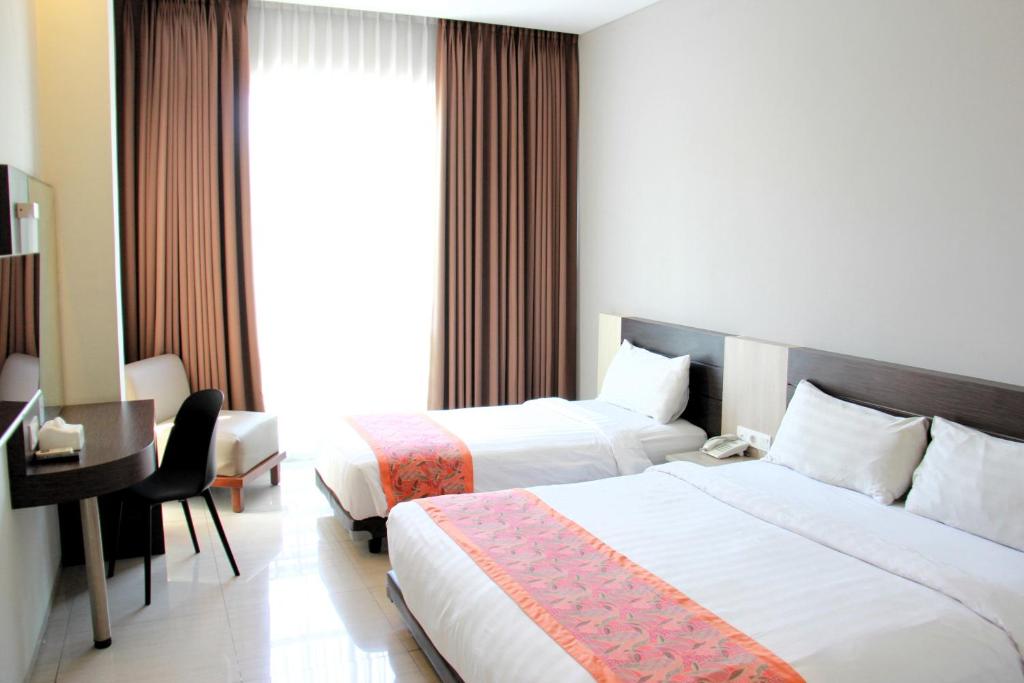 Postel nebo postele na pokoji v ubytování Moscato Hotel
