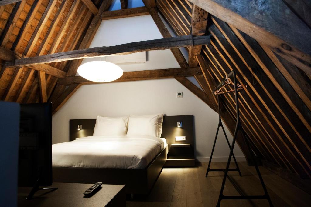 Postel nebo postele na pokoji v ubytování Hotel Katoen