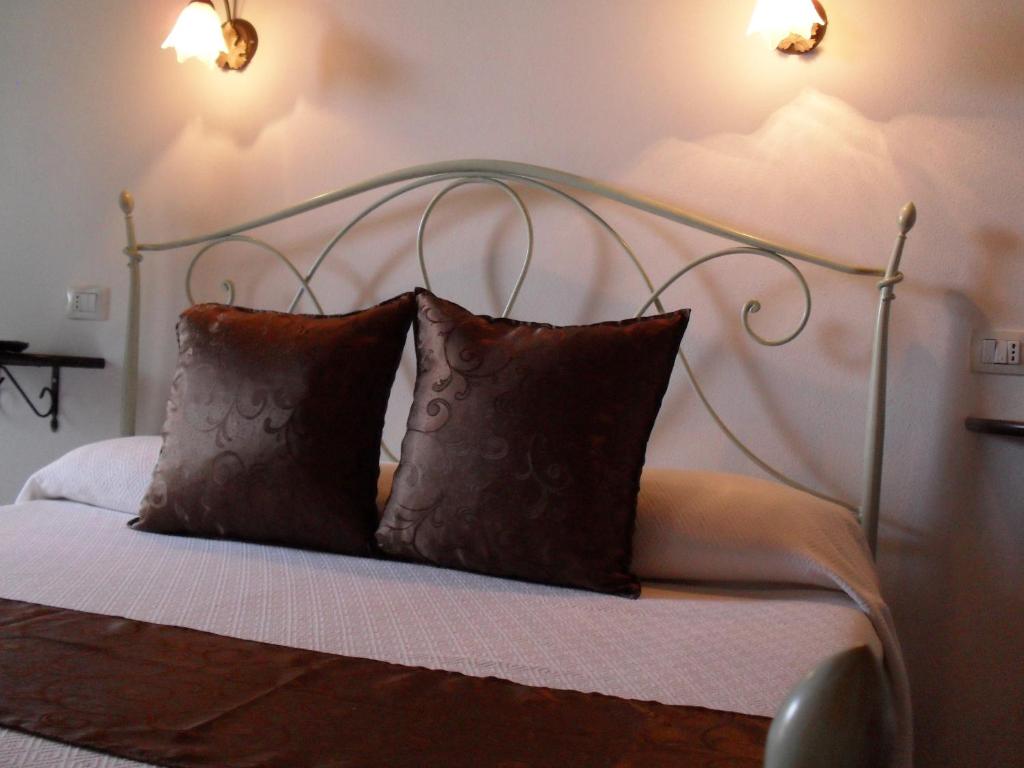 Postel nebo postele na pokoji v ubytování Il Vigneto B&B