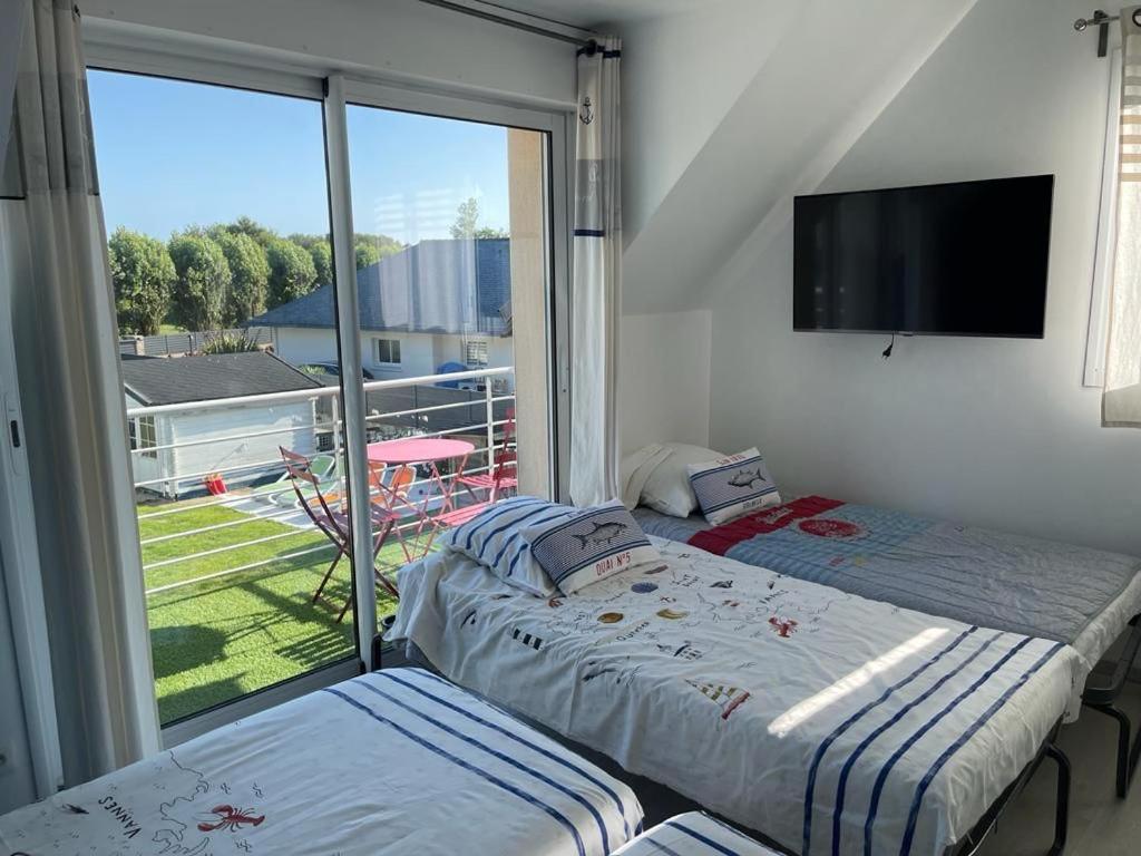 Postel nebo postele na pokoji v ubytování La Villa KEROMER
