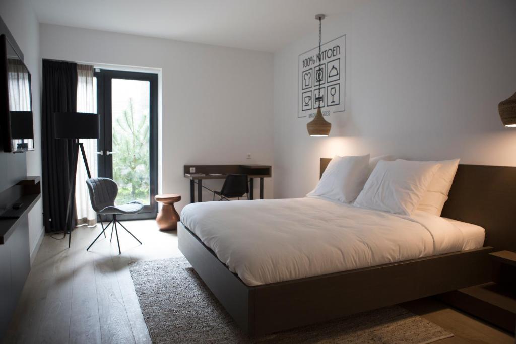 Postel nebo postele na pokoji v ubytování Hotel Katoen