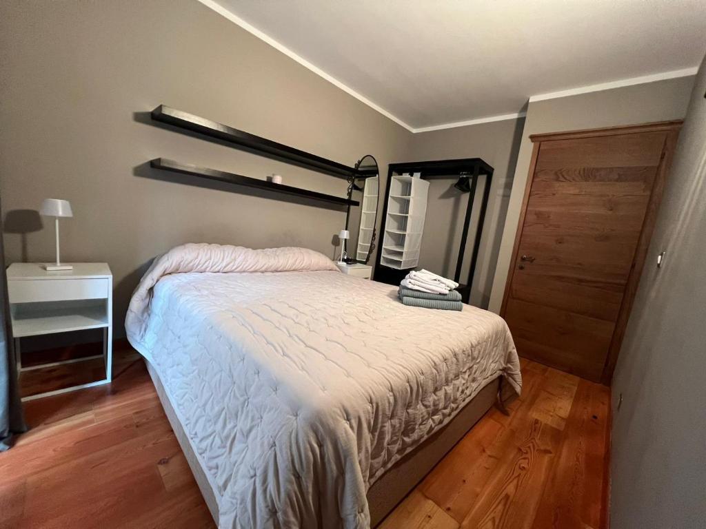 Łóżko lub łóżka w pokoju w obiekcie Casa Monique - Borgo Le Stalle Lunghe