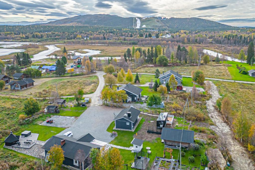 an aerial view of a village with houses and trees at Levi Nietos in Kittilä