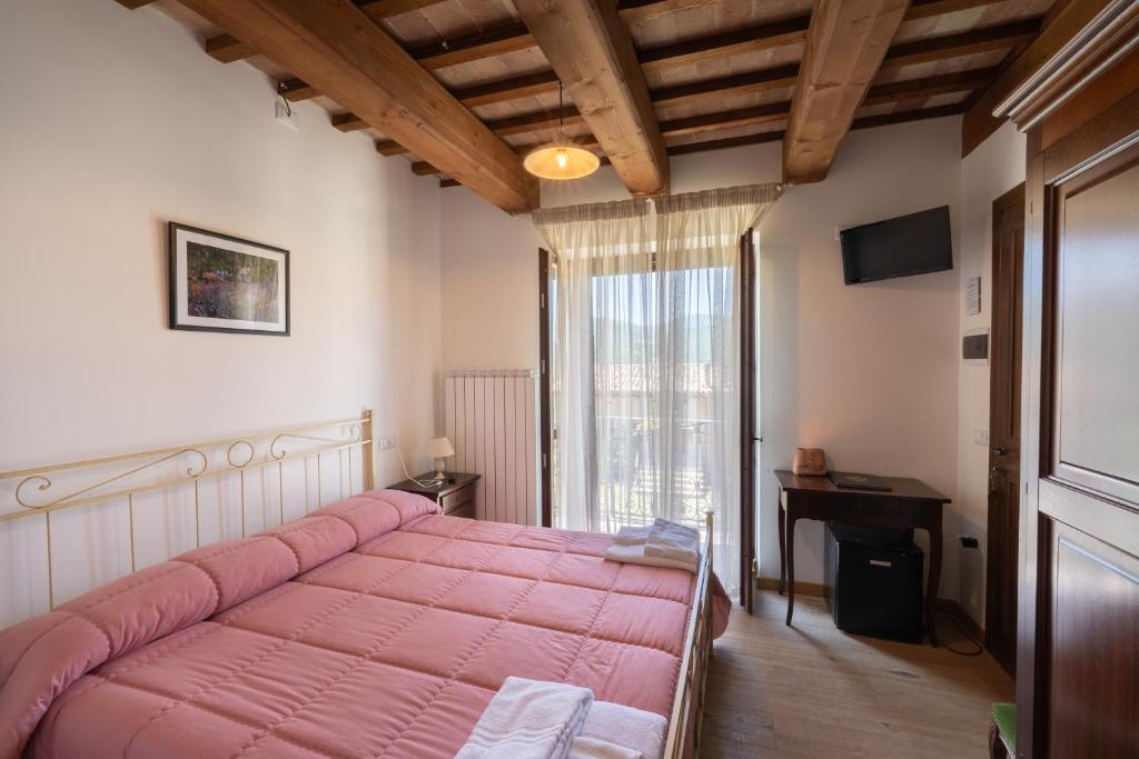 Postel nebo postele na pokoji v ubytování Agriturismo Rocca del Nera