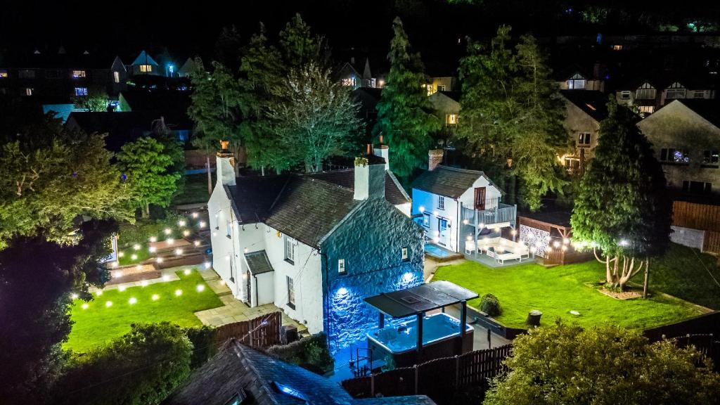 an aerial view of a house at night at Farm House at Mochdre Cottages in Conwy