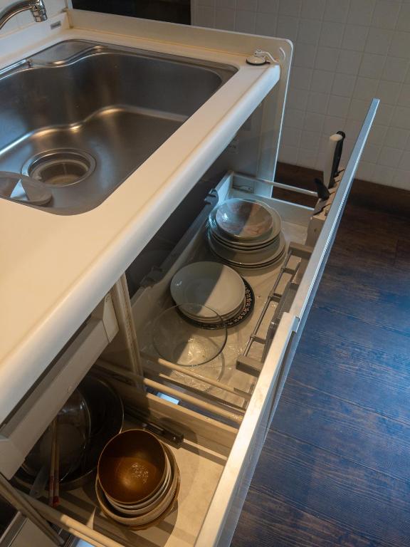 Kuchyň nebo kuchyňský kout v ubytování HARMONY HOTEL Urawa