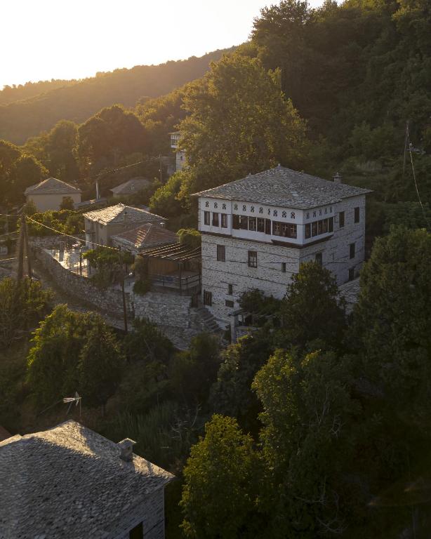 a large white building in the middle of a city at Santikos Mansion, Santikos Collection in Vyzitsa