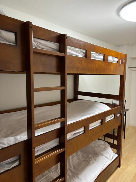 Postel nebo postele na pokoji v ubytování HARMONY HOTEL Urawa