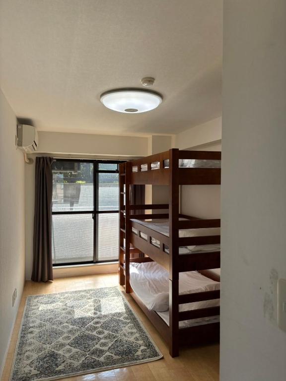 Postel nebo postele na pokoji v ubytování HARMONY HOTEL Urawa