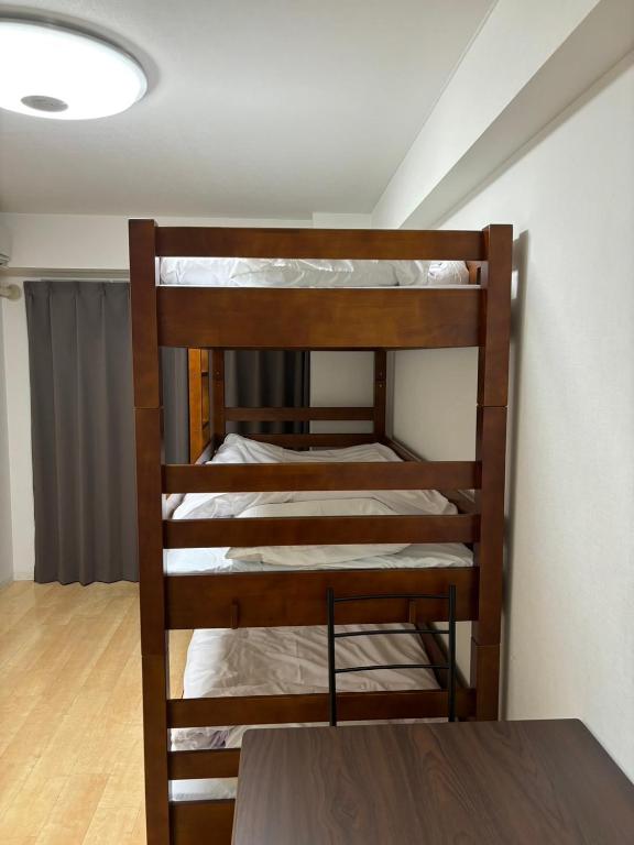 Postel nebo postele na pokoji v ubytování HARMONY HOTEL Urawa