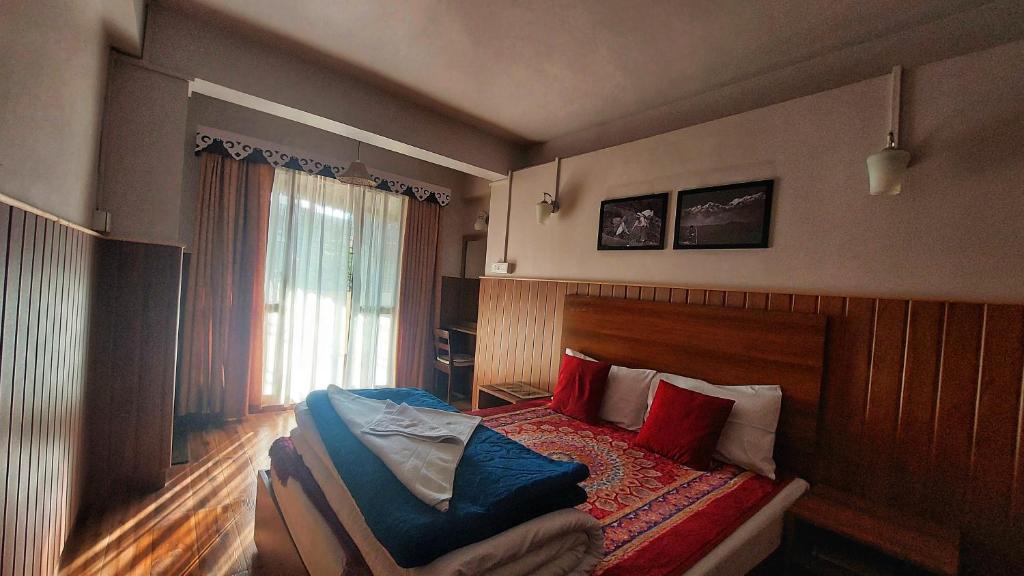 Postel nebo postele na pokoji v ubytování Indivar Homestay