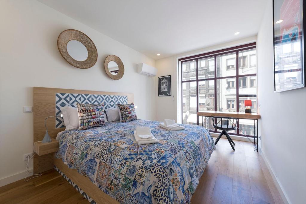 Postel nebo postele na pokoji v ubytování Contemporary Flat near São Bento by LovelyStay