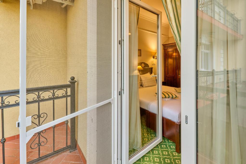 Postel nebo postele na pokoji v ubytování Hotel Classico Timisoara
