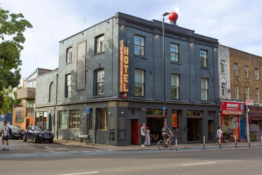 a building on the corner of a city street at The Cherry Rooms in London
