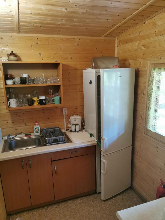 Kuchyňa alebo kuchynka v ubytovaní Domki drewniane alpejskie