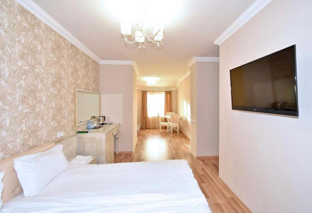 TV a/nebo společenská místnost v ubytování Homestay Hotel