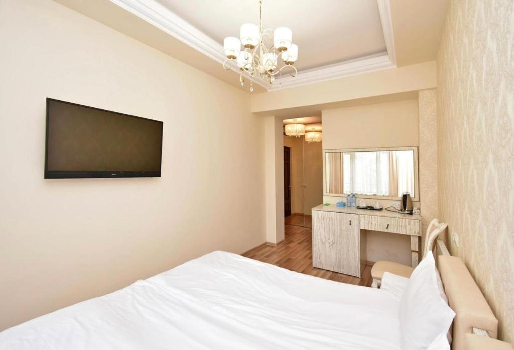 TV a/nebo společenská místnost v ubytování Homestay Hotel