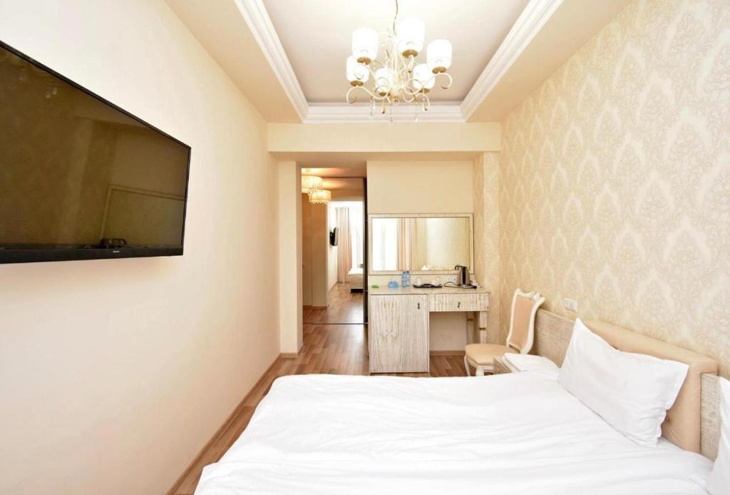 Postel nebo postele na pokoji v ubytování Homestay Hotel