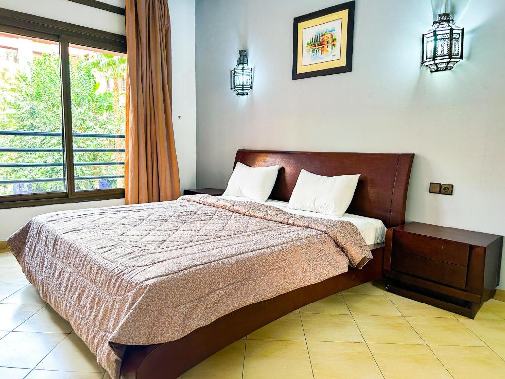 Postel nebo postele na pokoji v ubytování Mogador Menzah Appart Hôtel
