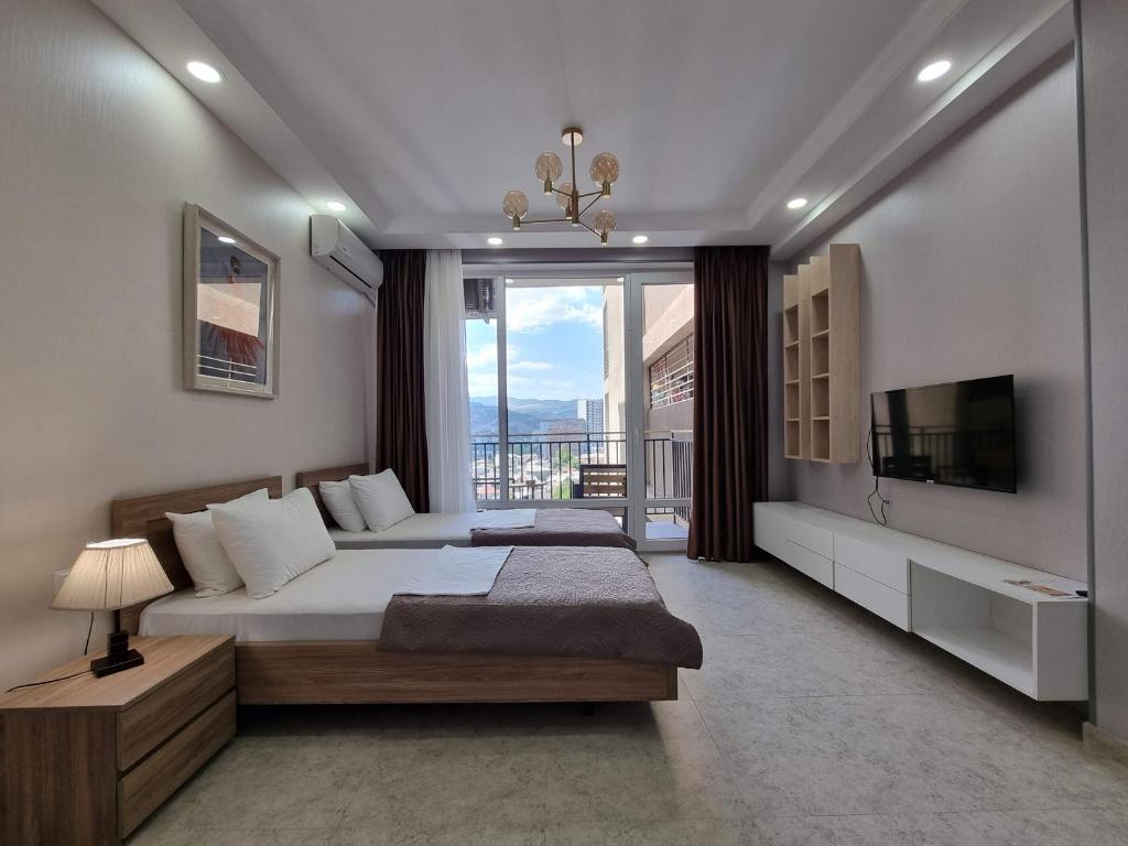 TV a/nebo společenská místnost v ubytování MD Apart Hotel Tbilisi