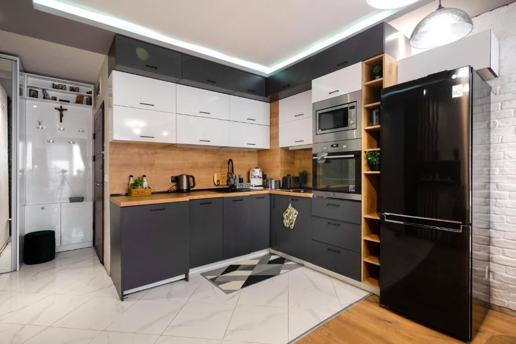 Kuchyň nebo kuchyňský kout v ubytování Feel Right at Home - Bright and Modern Apartment by Flat Mаnager