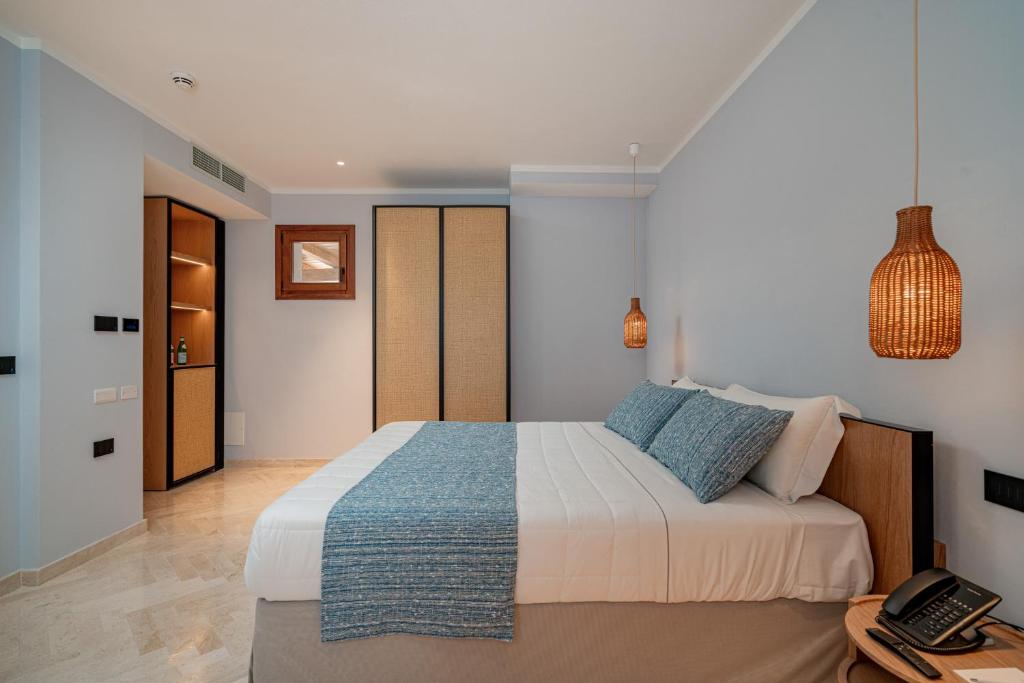 Postel nebo postele na pokoji v ubytování Hotel Sestante