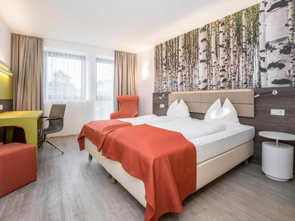 Postel nebo postele na pokoji v ubytování Eco Suite Hotel
