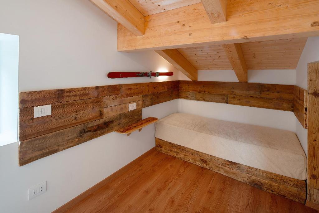 Postel nebo postele na pokoji v ubytování Thari House Dolomiti